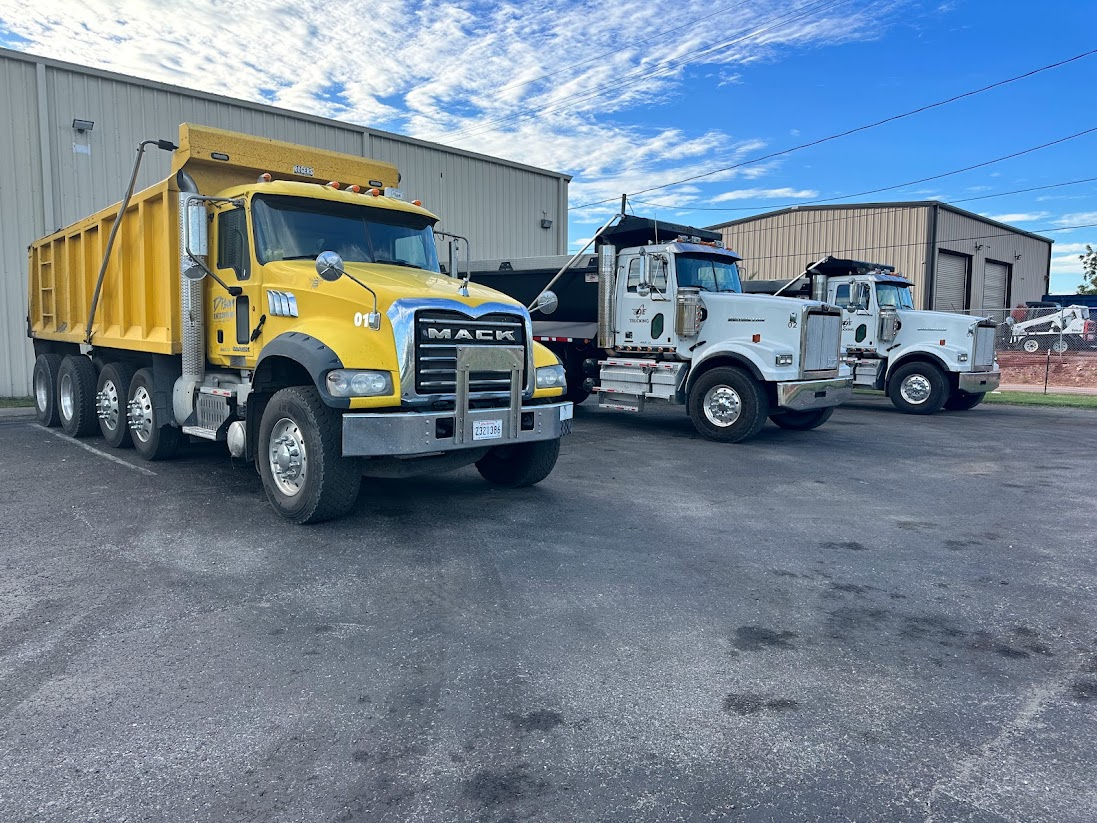Dison Enterprises dump trucks parked at the yard